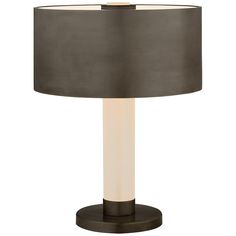 a table lamp with a black shade on it and a white light in the middle