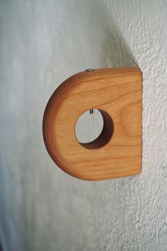 a wooden object hanging on the wall