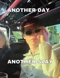 two people sitting in a car with the caption another day and another slay