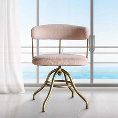 a pink chair sitting in front of a window next to a white wall and floor