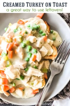 a white plate topped with chicken pot pie next to a fork and napkin on top of a table