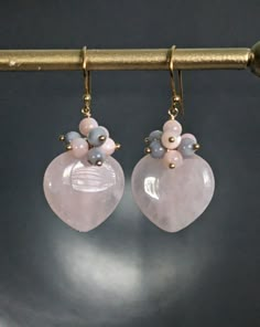 Rose Quartz and Mother of Pearl Heart Dangle 24 K Gold Filled Earrings, Jewelry Gift, Teeny Pinck Quartz Mother of Pearl Heart Earrings. They are about 1,6'' ( 41 mm.) long. * Processing time is 3 - 5 days.  * US orders are shipped first class mail. * International orders are shipped first class international. * Shipping upgrades are available at checkout. Thank you for visiting my listing! Have a wonderful day! Heart-shaped Dangle Earrings For Valentine's Day, Pearl Heart Earrings, Valentines Day Jewelry, Purple Dangle Earrings, Diy Jewelry Making Tutorials, Pearl Earring Set, Heart Jewellery, Chalcedony Earrings, Jewelry Making Earrings