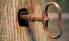 an old metal handle on a wooden door