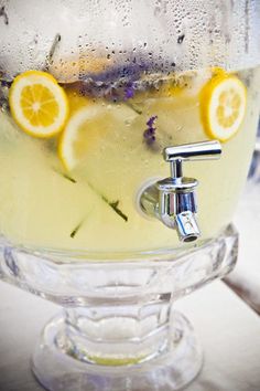 a pitcher filled with water and lemon slices