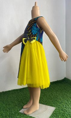 This colorful Princess dress has been made with all the care and love your little one deserves It is custom made to fit perfectly on your little one. It can be requested in other Ankara print of choice. It can be made with extra fullness It is made with 100% cotton Ankara fabric and luxurious tulle Simply start a conversation with me and I will be glad to be of service  Inner soft lining Back zipper sleeveless Fitted Tulle Sleeveless Dress For Dress-up, Whimsical Fitted Tulle Dress, Fitted Multicolor Tulle Dress, Whimsical Tulle Skirt Dress For Dress-up, Whimsical Dress-up Tulle Dress, Whimsical Sleeveless Tulle Dress, Multicolor Tulle Skirt Summer Dresses, Yellow Tulle Dress For Dress-up Occasions, Fitted Tulle Princess Sleeveless Dress