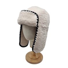 Stay stylish and snug this autumn and winter with our newest addition, the Dannika Trapper Hat. Perfectly matching our beloved Dannika Gilet, this hat is designed for the modern woman who values both fashion and comfort. Available in elegant Cream and classic Black, the Dannika Trapper Hat is your go-to accessory for those chilly days. Crafted with premium materials, this hat ensures warmth without compromising on style. The soft lining and chic design make it a must-have for your winter wardrobe. Whether you’re heading out for a brisk walk or a cozy coffee date, the Dannika Trapper Hat will keep you looking fabulous and feeling comfortable. 100% Polyester Dry Clean Brisk Walk, Cozy Coffee, Trapper Hat, Brand Magazine, Trapper Hats, August Birthstone Jewelry, Hat Design, Artisan Gift, Coffee Cozy