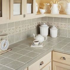 the kitchen counter is clean and ready to be used for tea or coffee makings