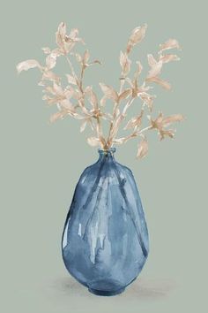 a blue vase with some white flowers in it