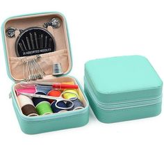 an open suitcase filled with crafting supplies on a white background and the lid opened to show it's contents