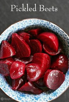 a bowl filled with sliced beets on top of a table