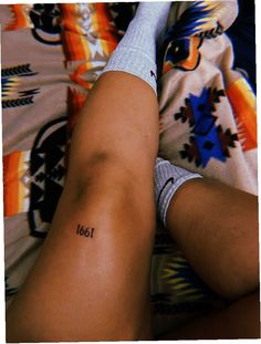 a person with a small tattoo on their leg