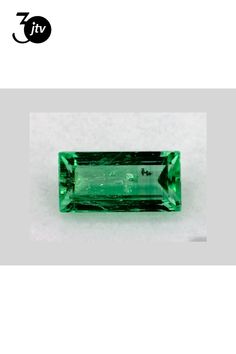 an emerald green tourmaline stone on a white background with the words, ijv