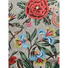 an embroidered fabric with flowers and leaves on grey, red, blue, yellow and green colors