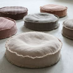 six round cushions sitting on top of a floor next to each other with the words xanadu outdoor factory