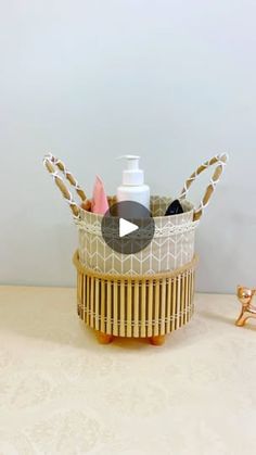 a basket with toothbrushes and lotion in it sitting on a counter top