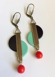 Stunning pair of earrings Black & turquoise bakelite & galalith with vintage Czech opaque red glass dangle beadGold Tone Metal ( I also have this style in silver - please check my shop )each pair of earrings are unique. handmade & reworked with original vintage bakelite & galalith from my own collection. I will only make a few pairs in each colour/design due to rarity of vintage Bakelite - look fabulous on - very striking !lever-back for pierced ears , lead & nickel freein ex Retro Red Dangle Earrings, Handmade Retro Bakelite Jewelry, Art Deco Earrings Vintage, Deco Earrings, Black Turquoise, Jazz Age, Colour Design, Vintage Bakelite, Art Deco Earrings