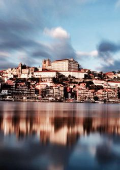 the city is reflected in the still water