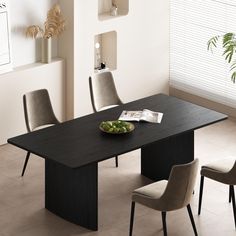 a dining table with four chairs and a bowl of fruit on the plate next to it