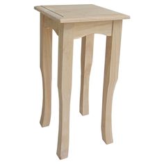 a small wooden table sitting on top of a white floor