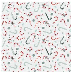 christmas candy canes and snowflakes on white fabric