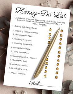 the honey do list with a pen on top of it and flowers in the background