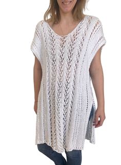 Hand-knit in a lightweight, cotton blended yarn, The Layla Kaftan is an easy summer staple. The lace stitch adds texture and is a unique feature of this timeless warm-weather classic. From sitting on the beach in your favorite swimwear, to a stroll into town paired with your favorite summer pants, this knit will be a no-brainer all season long. Each Ready Made Third Piece is individually hand-knit through our team of knitters based Boston, Massachusetts and produced in small batches. PRODUCT DET Spring Knit Cover-up For Warm Weather, White Cotton Cover-up For Warm Weather, Spring White Knit Cover-up, Casual White Cover-up With Crochet Trim, Crochet V-neck Top For Summer, Summer V-neck Crochet Top For Layering, Bohemian V-neck Knit Top For Beach, Summer V-neck Knit Top For Beach, Summer Pointelle Knit Top For Beach