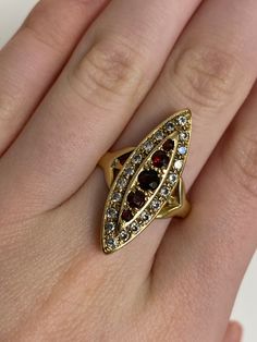 9ct Rare Find Vintage Yellow Gold Garnet & Cubic Zirconia Dress Ring * January Gemstone  🔹Sale Price - £235.00 🔹Ring Size - T (UK) , 10 (USA) 🔹Weight - 5 grams All articles come presented in a gift box January Gemstone, Targaryen Queen, Eclectic Outfits, New Gold Jewellery Designs, Pretty Accessories, Red Ring, Garnet Jewelry, Brooch Jewelry, Fancy Jewelry