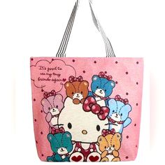 a pink hello kitty tote bag with teddy bears and hearts on the front, says it's good to be very loved by someone