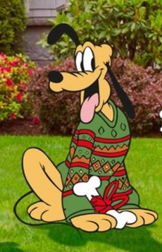 a cartoon dog sitting in the grass with its tongue out