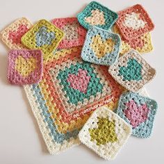 crocheted squares are arranged on top of each other in different colors and shapes