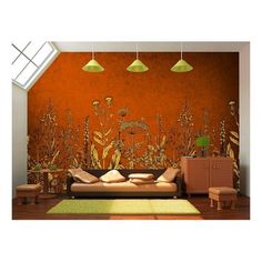 a living room with an orange wall and floral mural on the wall, along with two green lamps