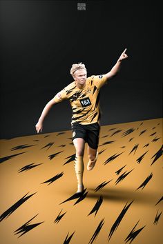 a female soccer player is running in the sand with her arms out to catch the ball