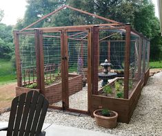 an outdoor garden area with a large bird cage