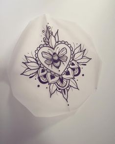 a white plate with a black and purple design on it's side, in the shape of a heart