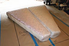 two mattresses are laying on the floor with measurements