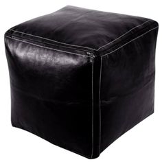 a black leather cube ottoman with stitching on the top and bottom, sitting against a white background