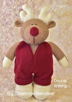 a knitted teddy bear wearing a red sweater and reindeer antlers