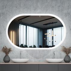 a bathroom with two sinks and a large mirror on the wall above it's counter