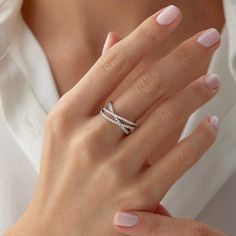 a woman's hand with two rings on it