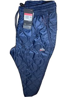 Nike NSW Heritage Winterized Trousers Sz Large Obsidian CU4448-451 NEW. Nike Wide-leg Bottoms For Streetwear, Nike Blue Fleece Bottoms, Nike 4-way Stretch Sportswear, Obsidian Nike, Nike Sporty 4-way Stretch Bottoms, Nike Fit, Air Jordan 12 Retro, Zip Ties, Jordan 12 Retro