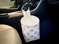 a cup that is sitting in the middle of a car