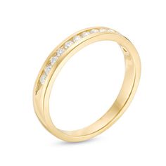 a yellow gold wedding ring with channeled diamonds