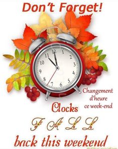 an alarm clock with autumn leaves around it and the words, don't forget