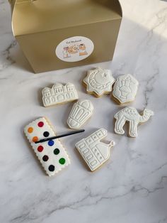 some cookies are sitting on a table next to a box