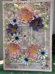 a close up of a card with flowers on it