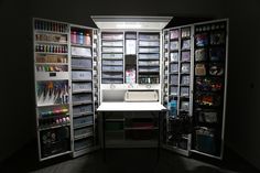 an open refrigerator with lots of items in it's storage area and lights shining on the door