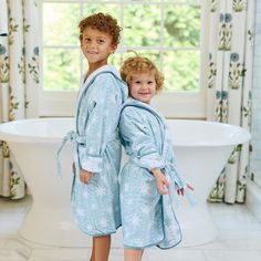 Matching moments made merry in terry. Say hello to the Plush Bath Robe, featuring Weezie’s take on velour. This new-to-Weezie style features a smooth, velour-like exterior lined with traditional terry. With a loopless fabrication (read: velvety soft and snag-free), the Plush Bath Robe is made for holiday magic. Our littlest Bath Robe features piped edges, pockets, and a hood for the perfect towel alternative post-bath. The sleeves can be rolled and bonus: the belt is attached so it doesn’t get l Household Gifts, Bath Robes, Kids Holiday, Matching Mom, Baby Bundles, Baby Towel, Personalized Embroidery, Kids Bath, Hooded Towel