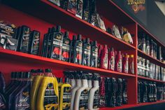 the shelves are filled with different types of motor oil and lubrir products for sale