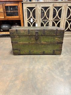 an old trunk is sitting on the floor