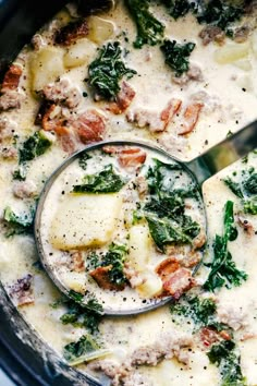 a close up of a bowl of food with broccoli and cheese in it